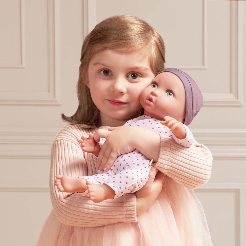 Lalka noworodek ze smoczkiem w pidżamce w kropeczki i czapeczce LullaBaby