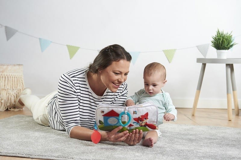 Miękka książeczka edukacyjna Moje Podróże Zabawa na łące - Tiny Love