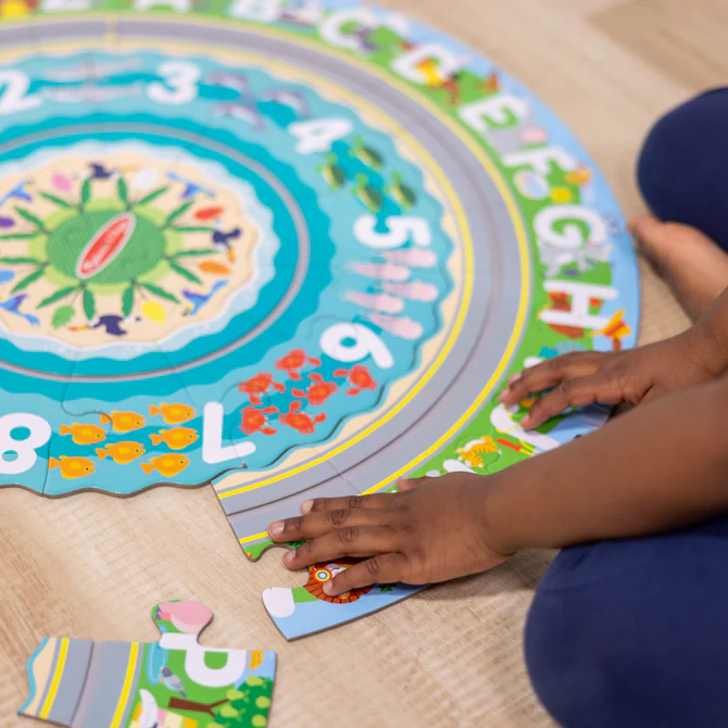Okrągłe puzzle podłogowe z nakręcanymi pojazdami Melissa & Doug